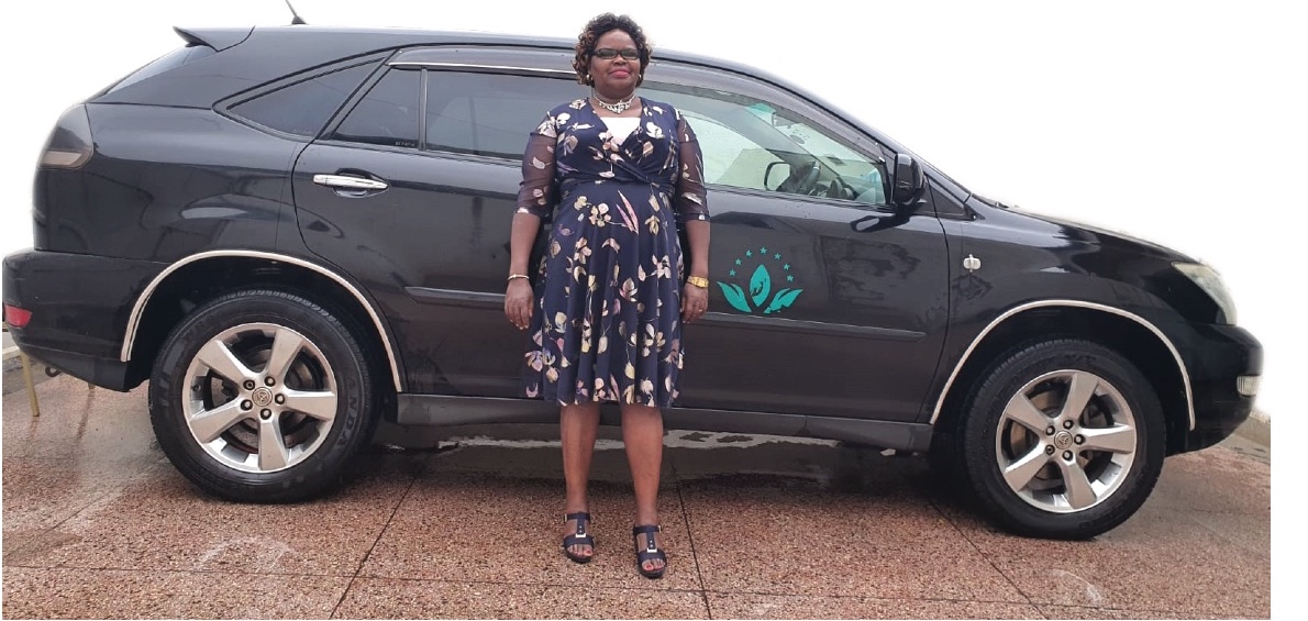 Lucy Miano with a Green World car